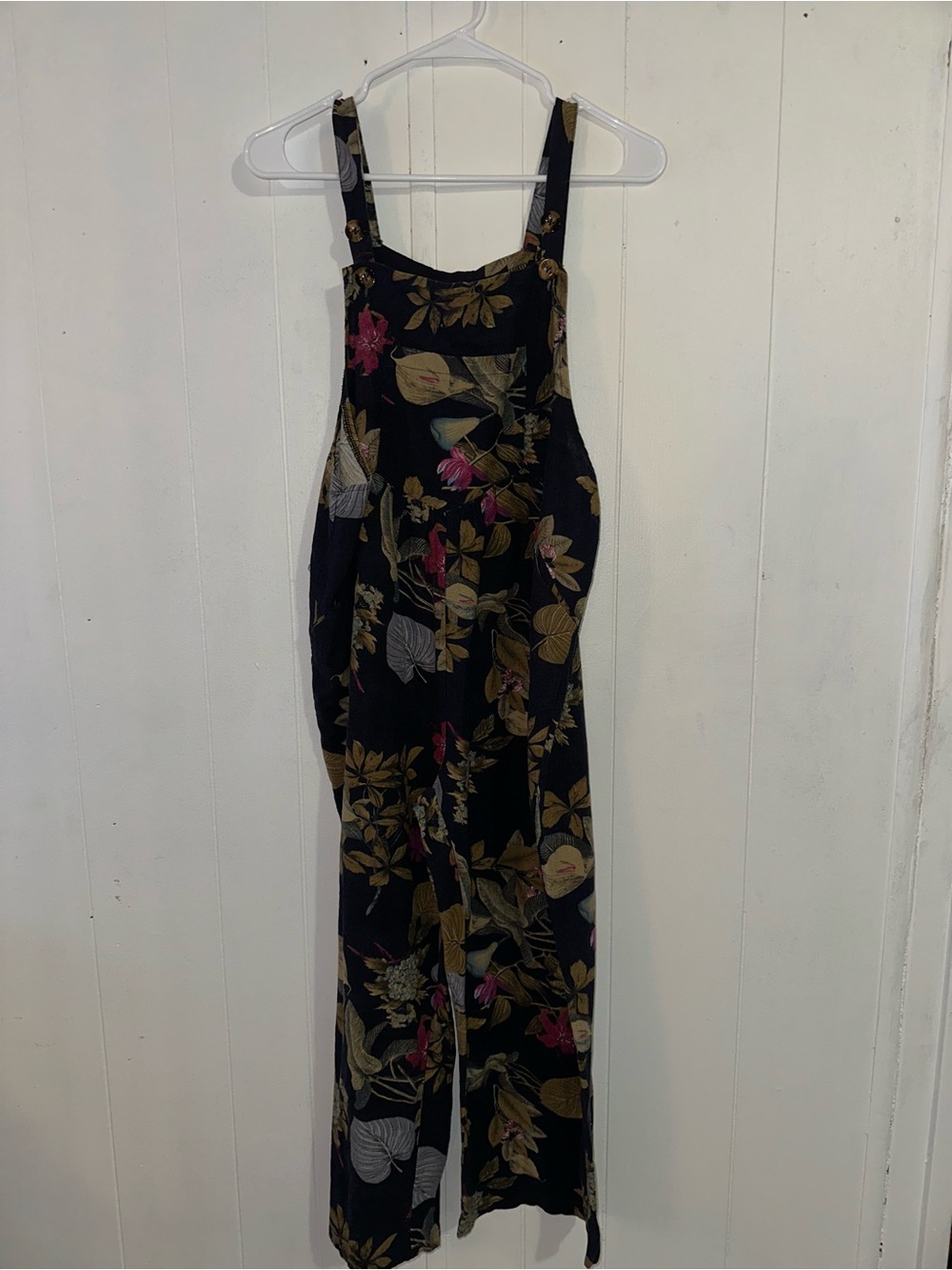 Black Floral Wide-Leg Jumpsuit with Adjustable Straps and front pocket